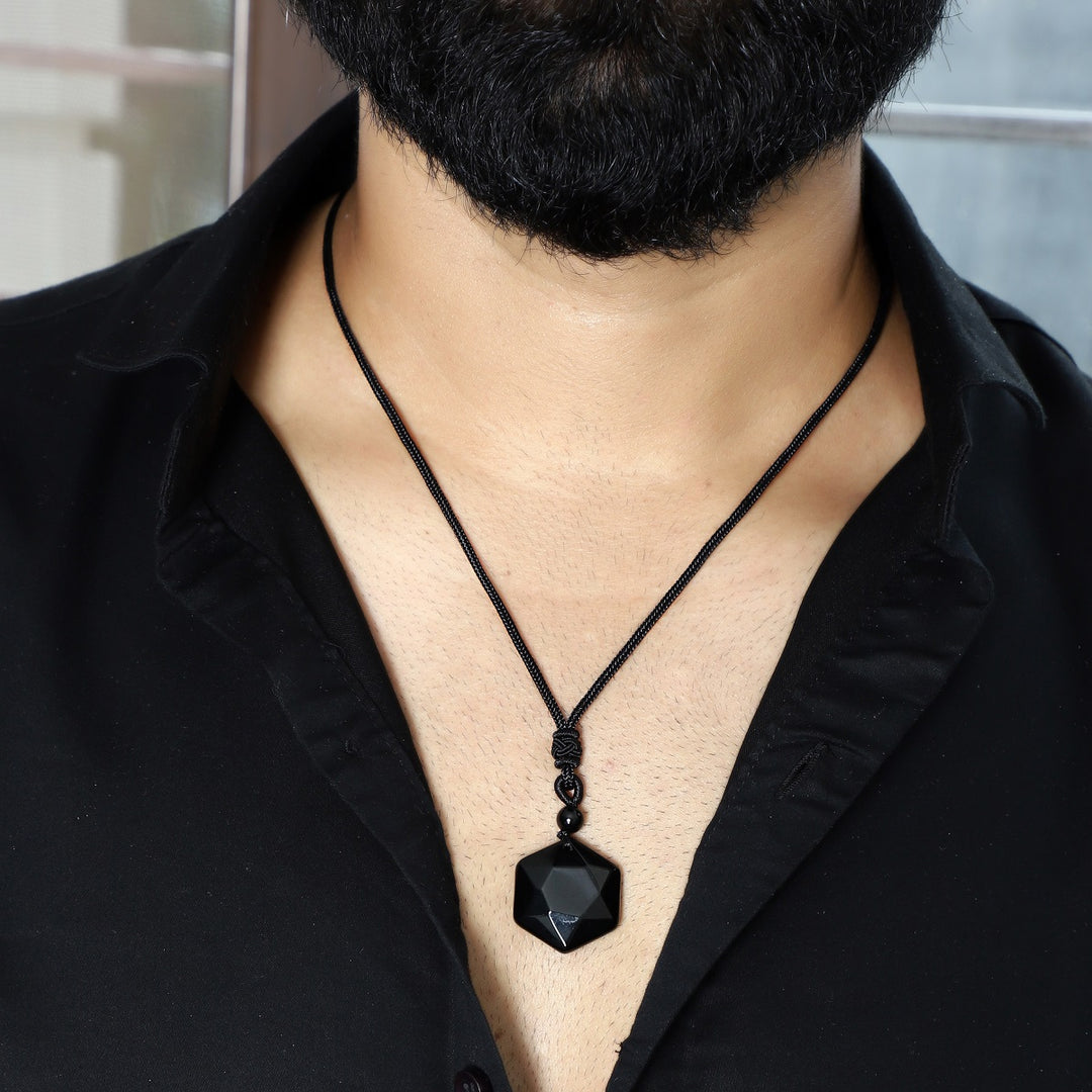 A visual representation of the weight of the pendant necklace, emphasizing its substantial yet comfortable feel on the neckline.
