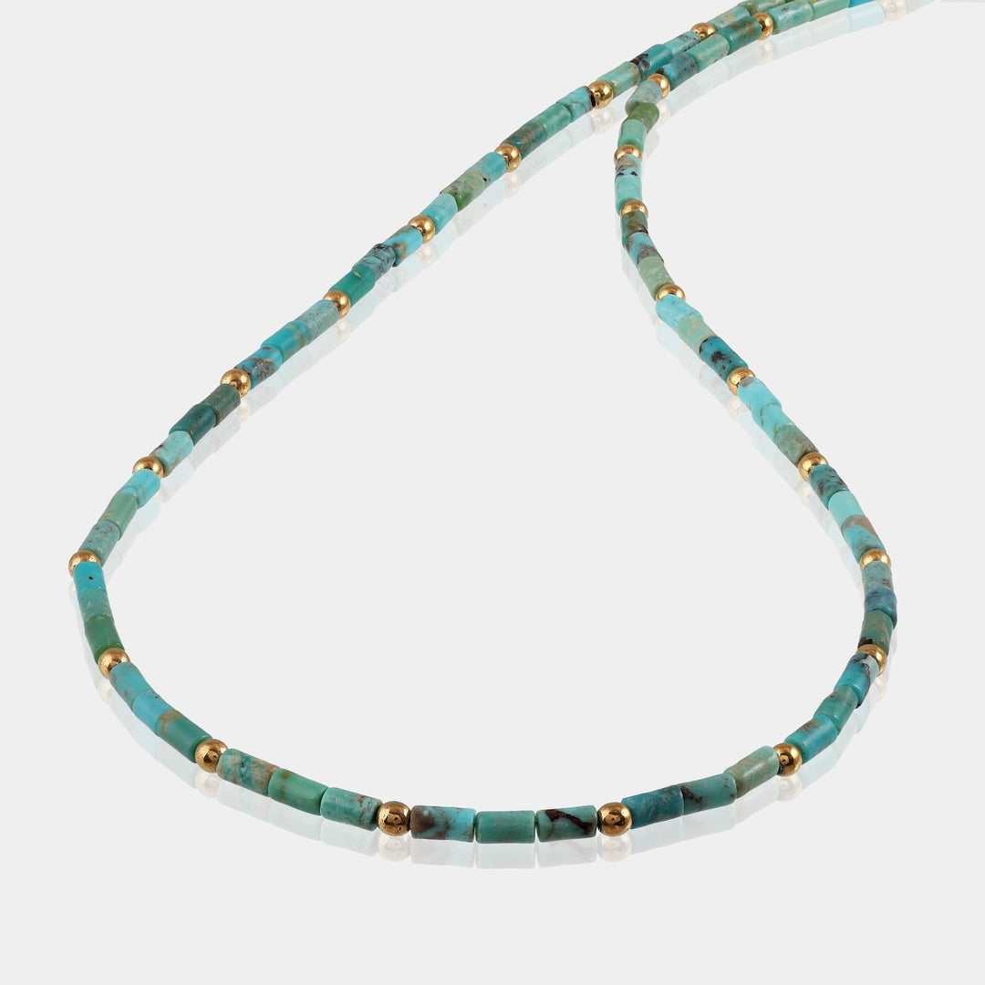 Detailed craftsmanship of the necklace's smooth tube Turquoise and round Hematite beads, handcrafted to perfection