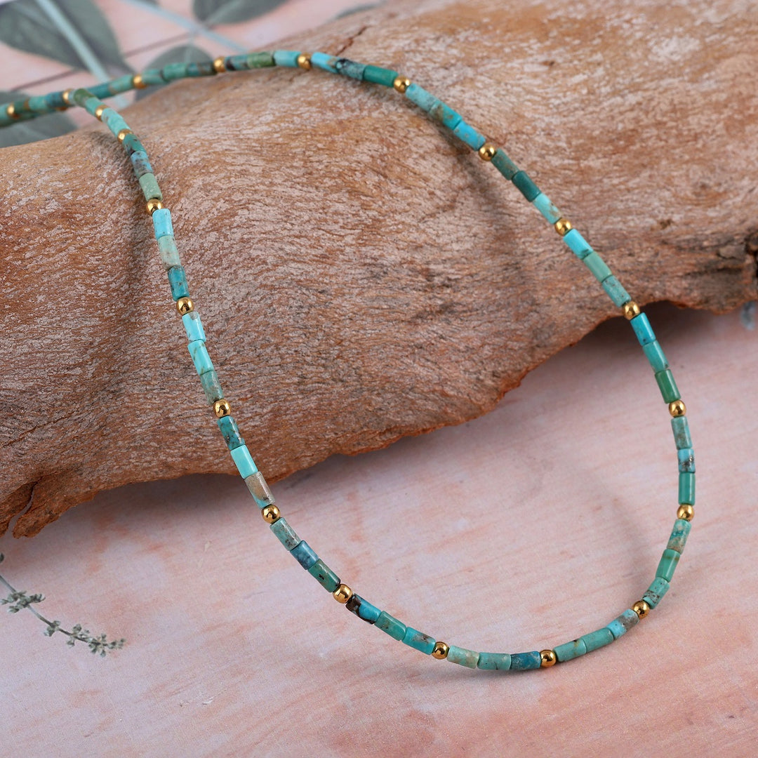 Close-up of our Natural Turquoise & Hematite Gemstone Beads Necklace featuring vibrant turquoise and gold hematite beads.