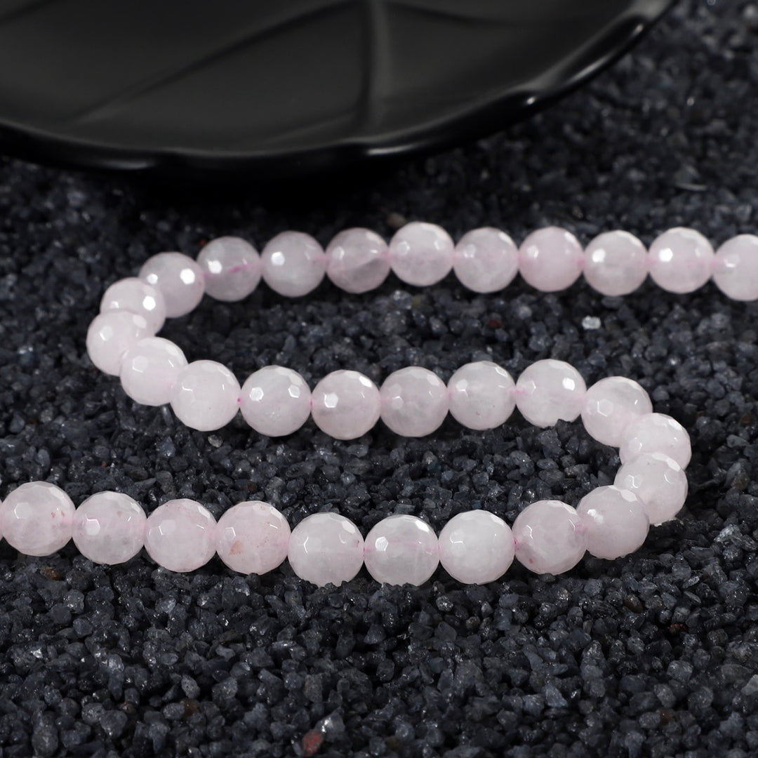 Close-up of Faceted Round Rose Quartz Beads