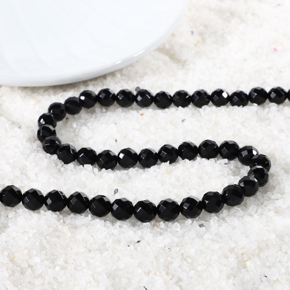 Close-up of Faceted Round Black Onyx Beads