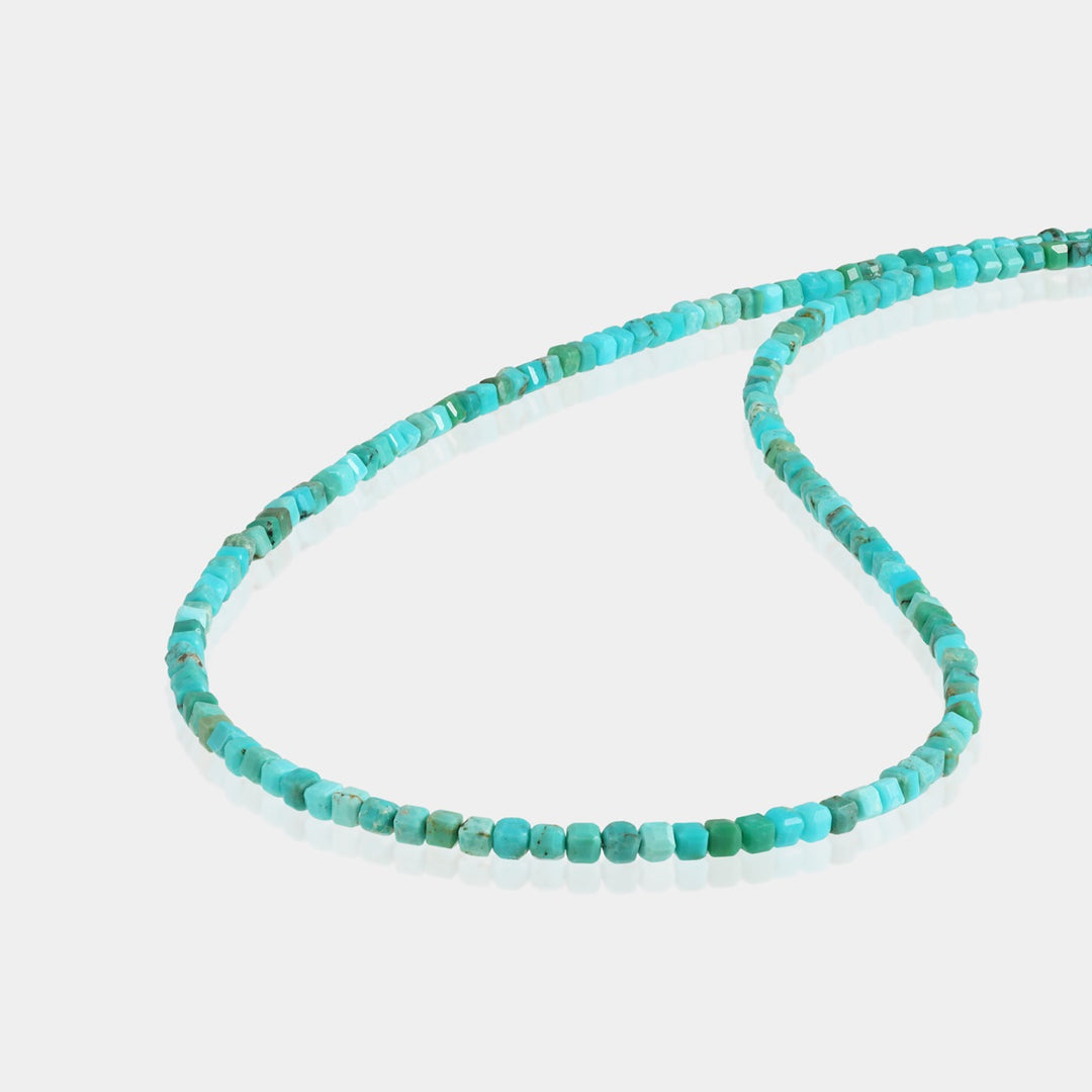 Close-up of 2mm Turquoise Cube Beads