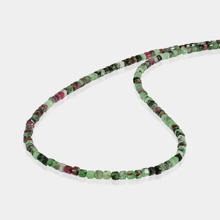 Close-up of 2mm Ruby Zoisite Cube Beads