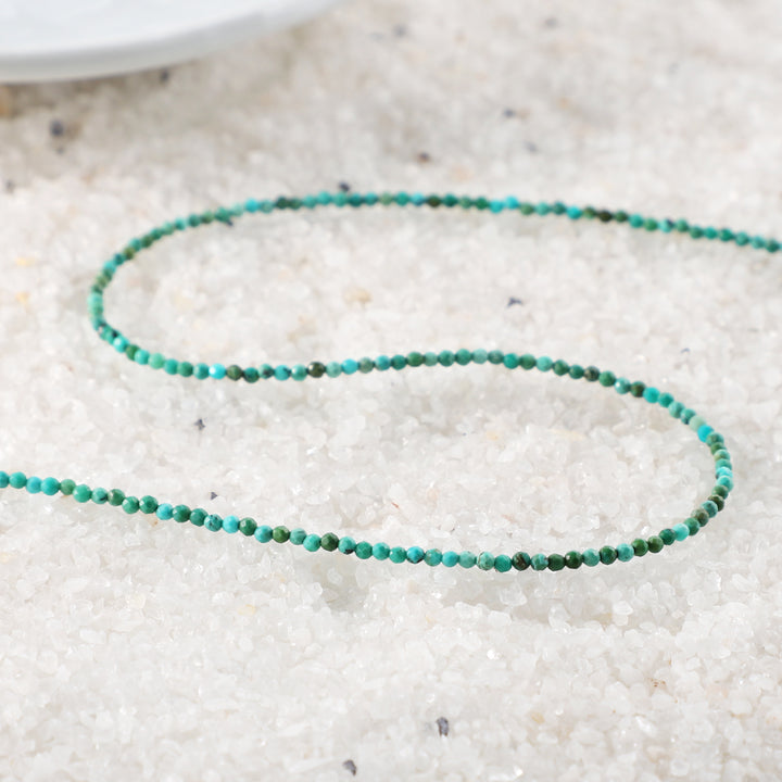 Close-up of Faceted Round Turquoise Beads"