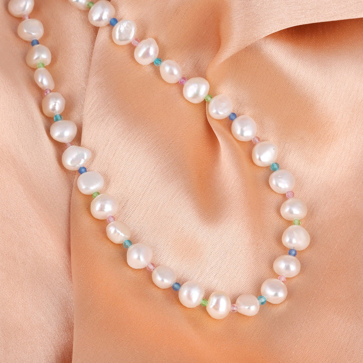 A stunning blend of white pearls and blue, green, and pink crystal quartz beads, handcrafted in sterling silver.