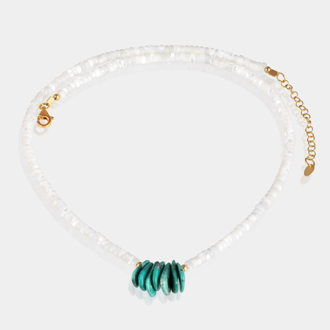 A beautiful blend of white Mother of Pearl and vibrant blue Turquoise beads on a 925 silver chain