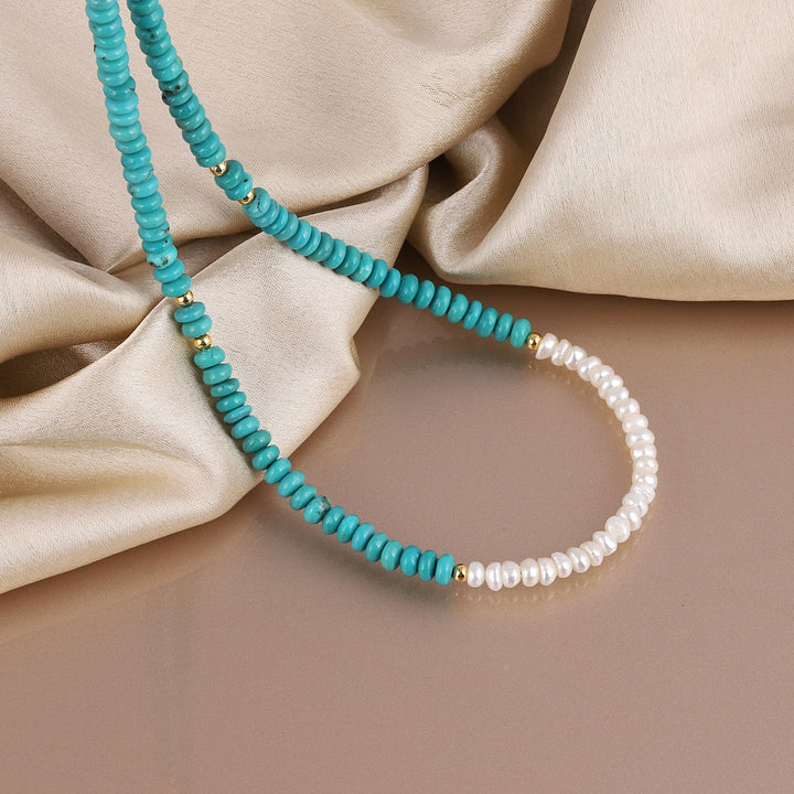 dorn yourself with the natural beauty of pearls and the enchanting allure of turquoise in this exquisite handmade necklace.