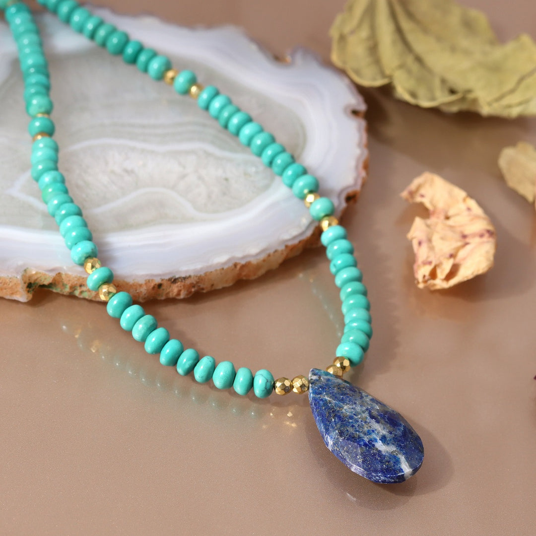 This 925 silver necklace features a captivating combination of turquoise, lapis lazuli, and hematite gemstone beads, perfect for adding sophistication to any outfit.