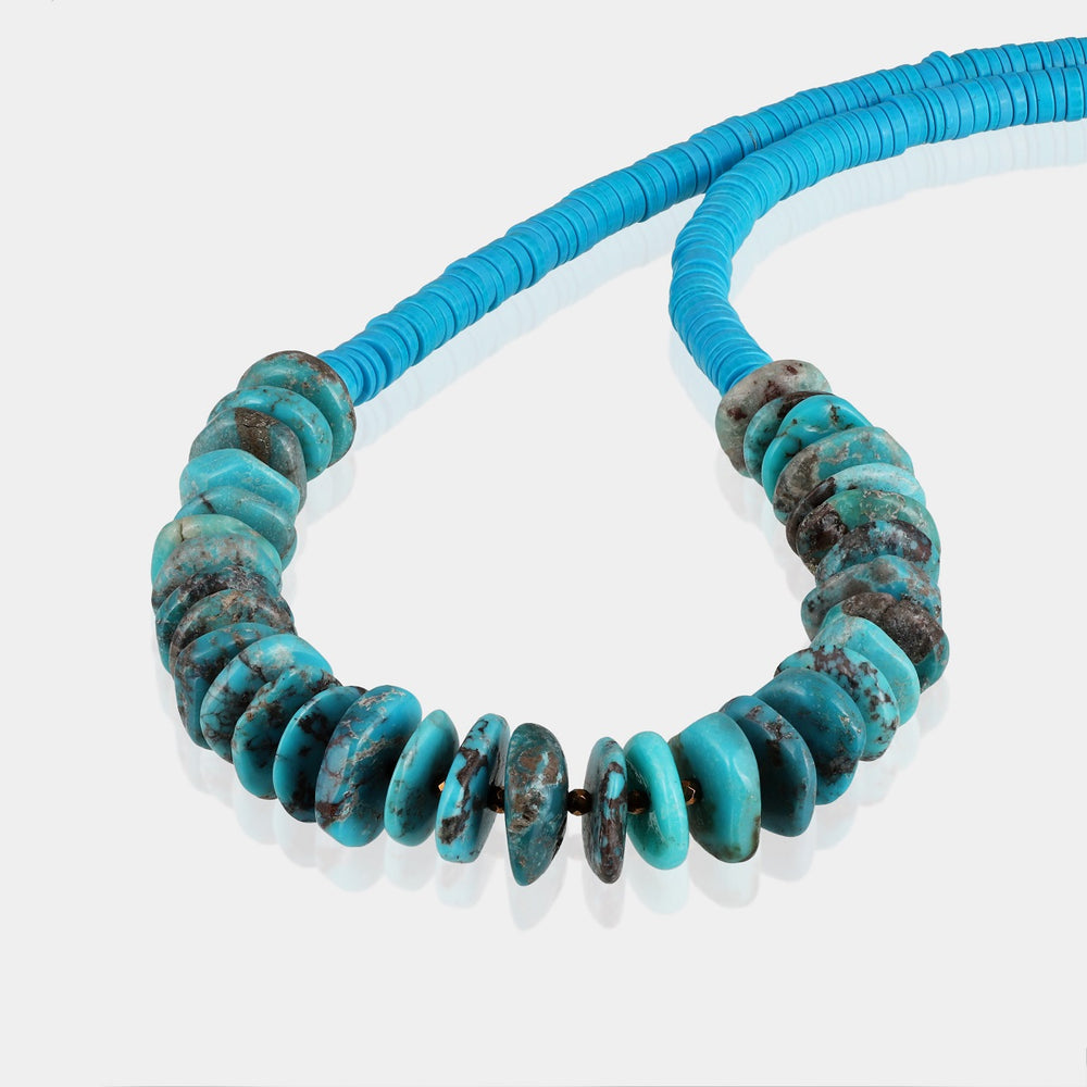 This exquisite piece features faceted round hematite beads, smooth saucer-shaped hematite beads, and smooth wheel-shaped turquoise beads.