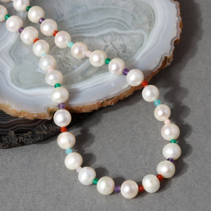 A beautiful blend of pearls, amethyst, pink opal, amazonite, green onyx, and red onyx gemstone beads, handcrafted in sterling silver.