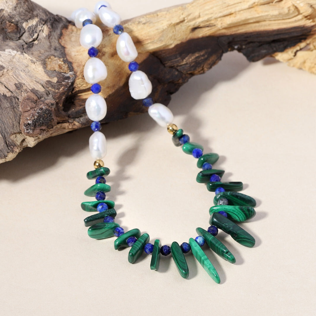 Smooth nugget-shaped Malachite gemstone in vibrant green, representing growth and transformation