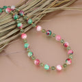 Vibrant green smooth round Green Apatite gemstone beads on silver necklace