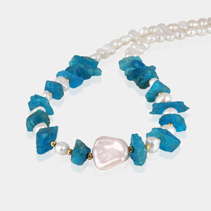 Striking neon blue rough nugget-shaped apatite gemstone beads on silver necklace