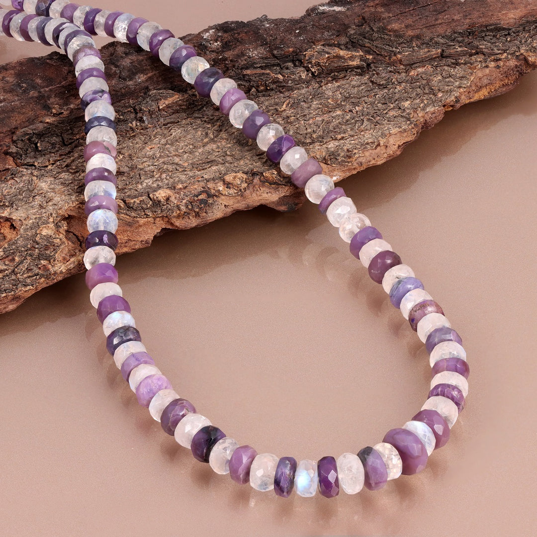 Faceted rondelle-shaped sugilite gemstone beads in purple color