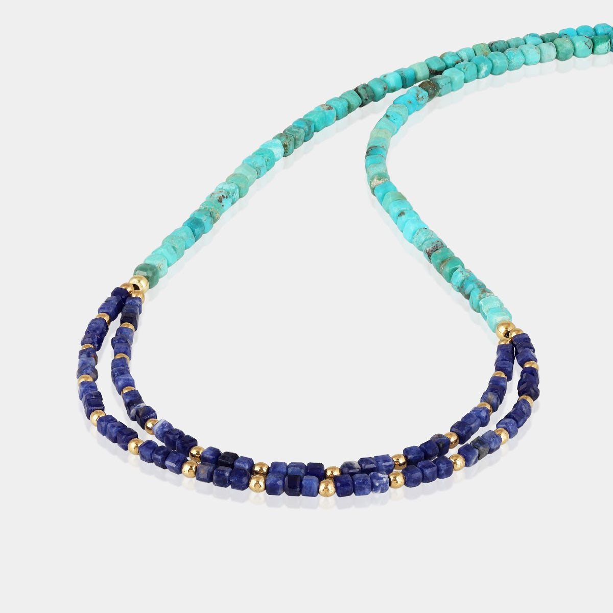 This handmade 925 silver necklace showcases the unique beauty of turquoise, sodalite, and hematite gemstones.