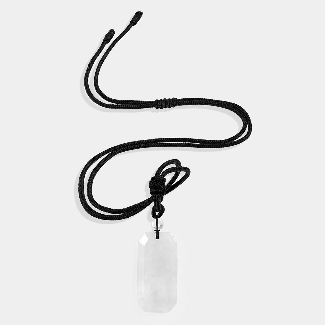 A close-up view of the pendant necklace showcasing the smooth baguette-shaped white quartz gemstone wrapped with an adjustable rope necklace, displaying its pure and ethereal white color.