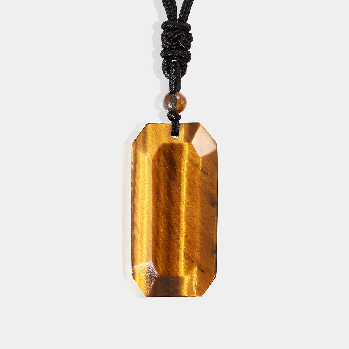  A stunning tiger's eye gemstone with a rich golden color and chatoyant bands, showcasing its natural beauty and unique patterns.