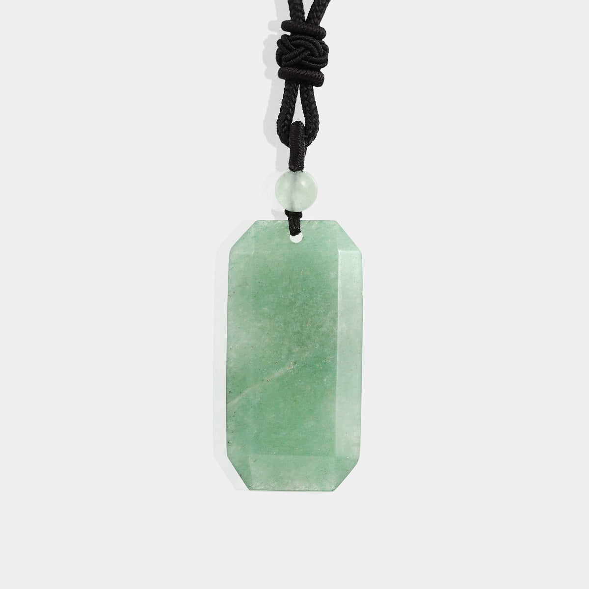 A stunning green aventurine gemstone with a smooth surface, radiating a calming and vibrant green hue.