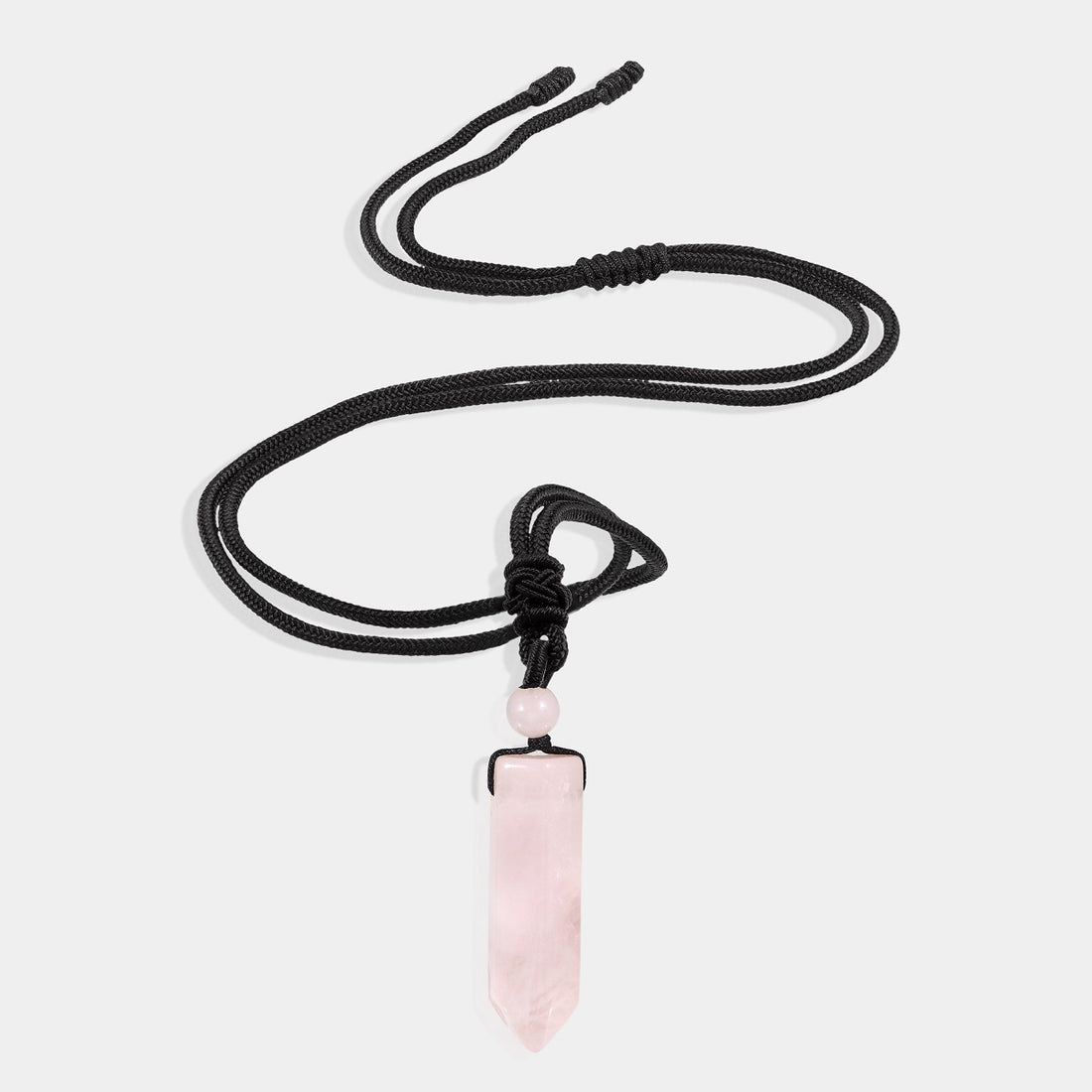 A smooth pendulum-cut rose quartz gemstone, measuring 16 x 36 mm, showcasing its captivating pink color and gentle energy.