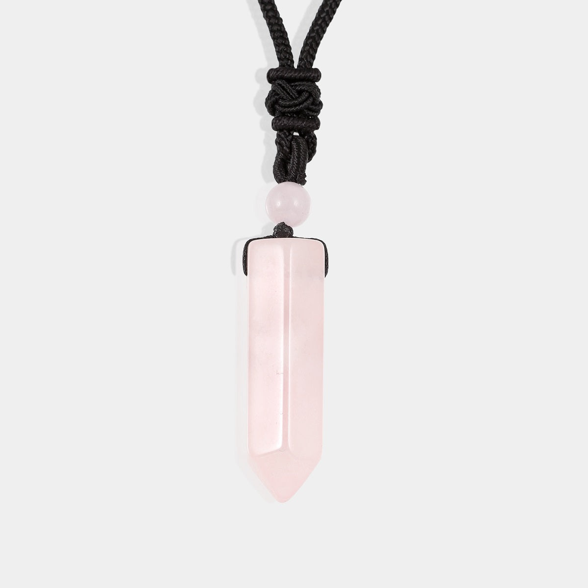 A smooth pendulum-cut rose quartz gemstone, measuring 16 x 36 mm, showcasing its captivating pink color and gentle energy.