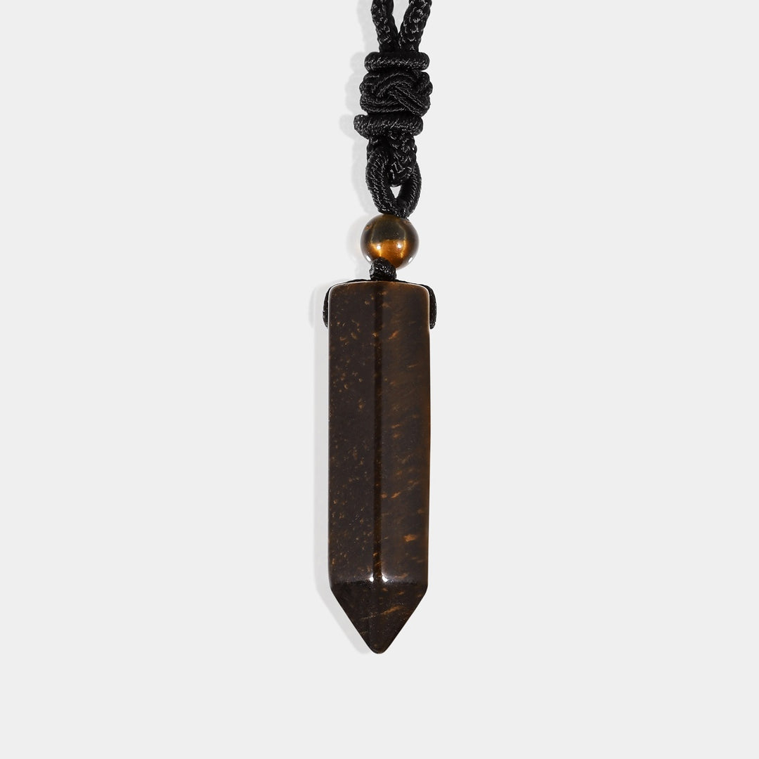 A smooth pendulum-cut Tiger's Eye gemstone, measuring 16 x 36 mm, showcasing its captivating golden-brown color and chatoyant effect.