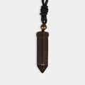 A smooth pendulum-cut Tiger's Eye gemstone, measuring 16 x 36 mm, showcasing its captivating golden-brown color and chatoyant effect.