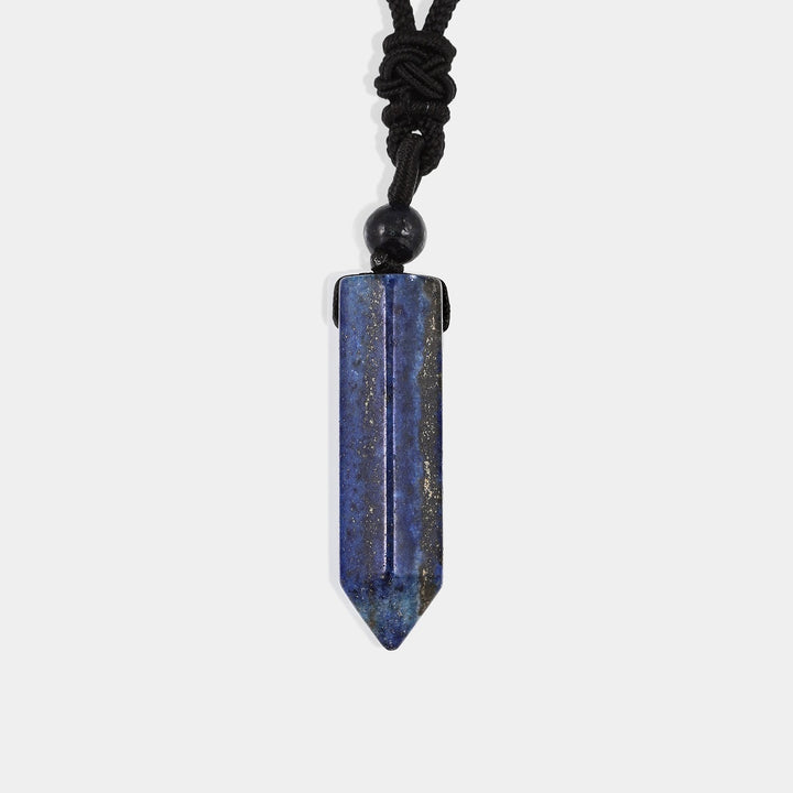 A smooth pendulum-cut Lapis Lazuli gemstone, measuring 16 x 36 mm, showcasing its deep blue color and golden pyrite flecks.