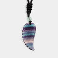 Exquisite carved wing pendant made of Fluorite.