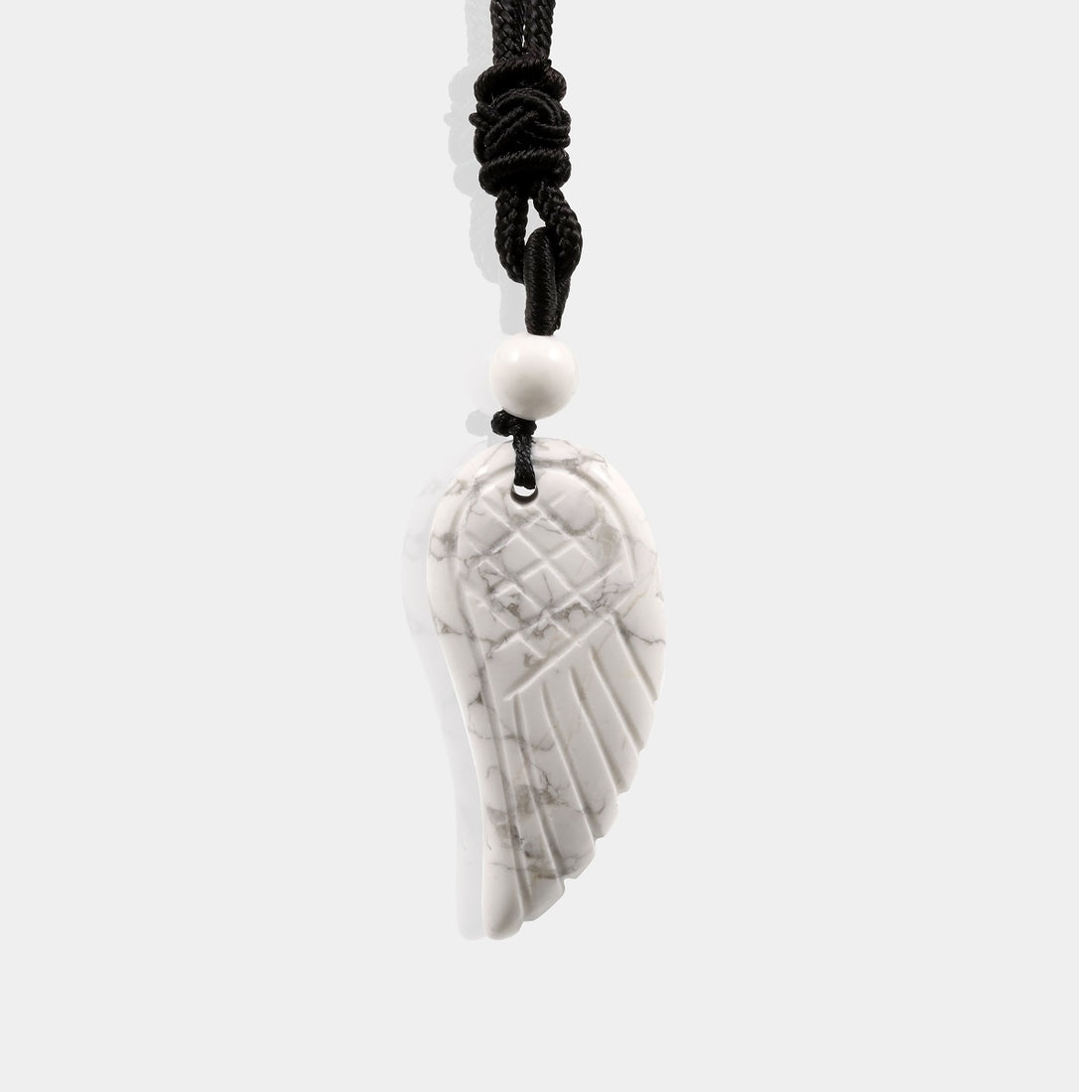 Natural Howlite Angel Wing Pendant Necklace with adjustable rope.