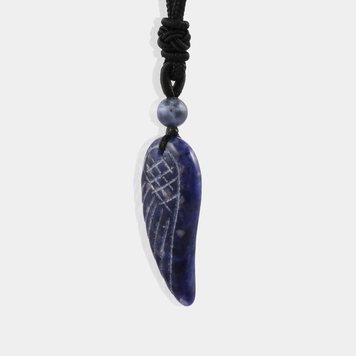 Smooth round Lapis Lazuli gemstone showcasing deep blue hues.