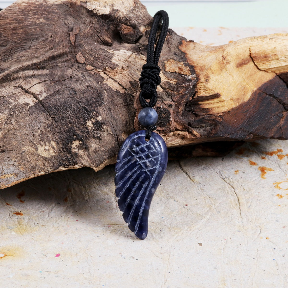 Pendant wrapped necklace featuring a Lapis Lazuli gemstone.