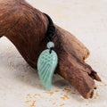 Pendant wrapped necklace featuring a green aventurine gemstone.