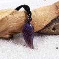 Pendant wrapped necklace featuring an Amethyst gemstone.