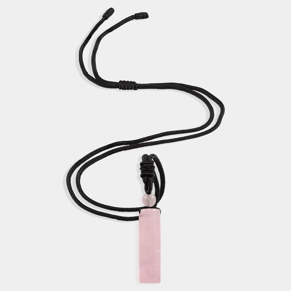Natural Rose Quartz Cylinder Adjustable Rope Pendant Necklace with pink gemstone and adjustable length.