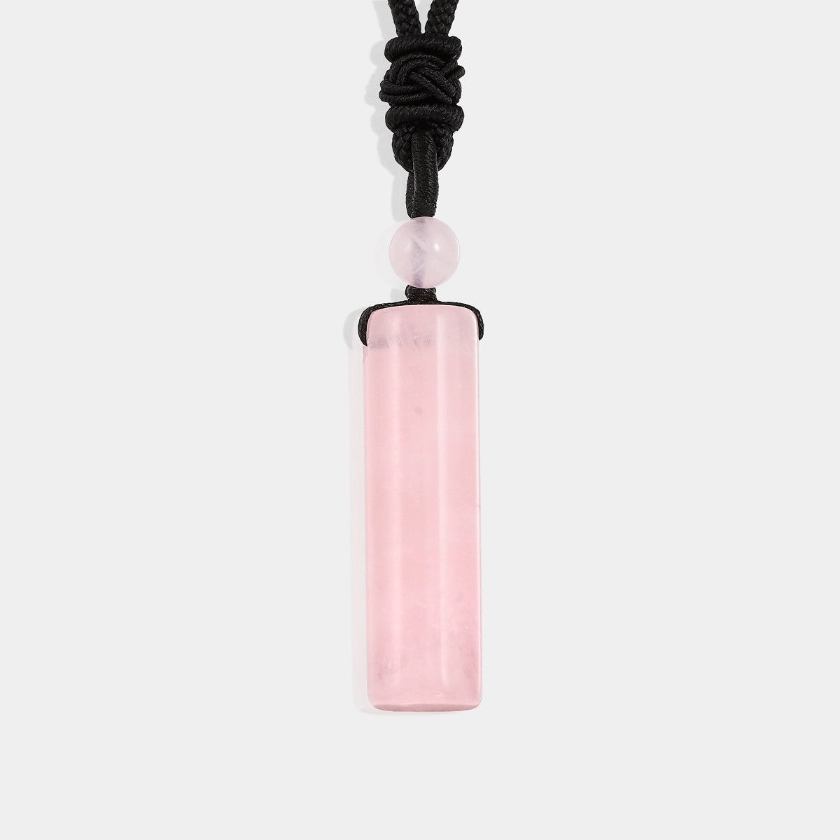 "Smooth cylinder-shaped Rose Quartz gemstone in soothing pink color