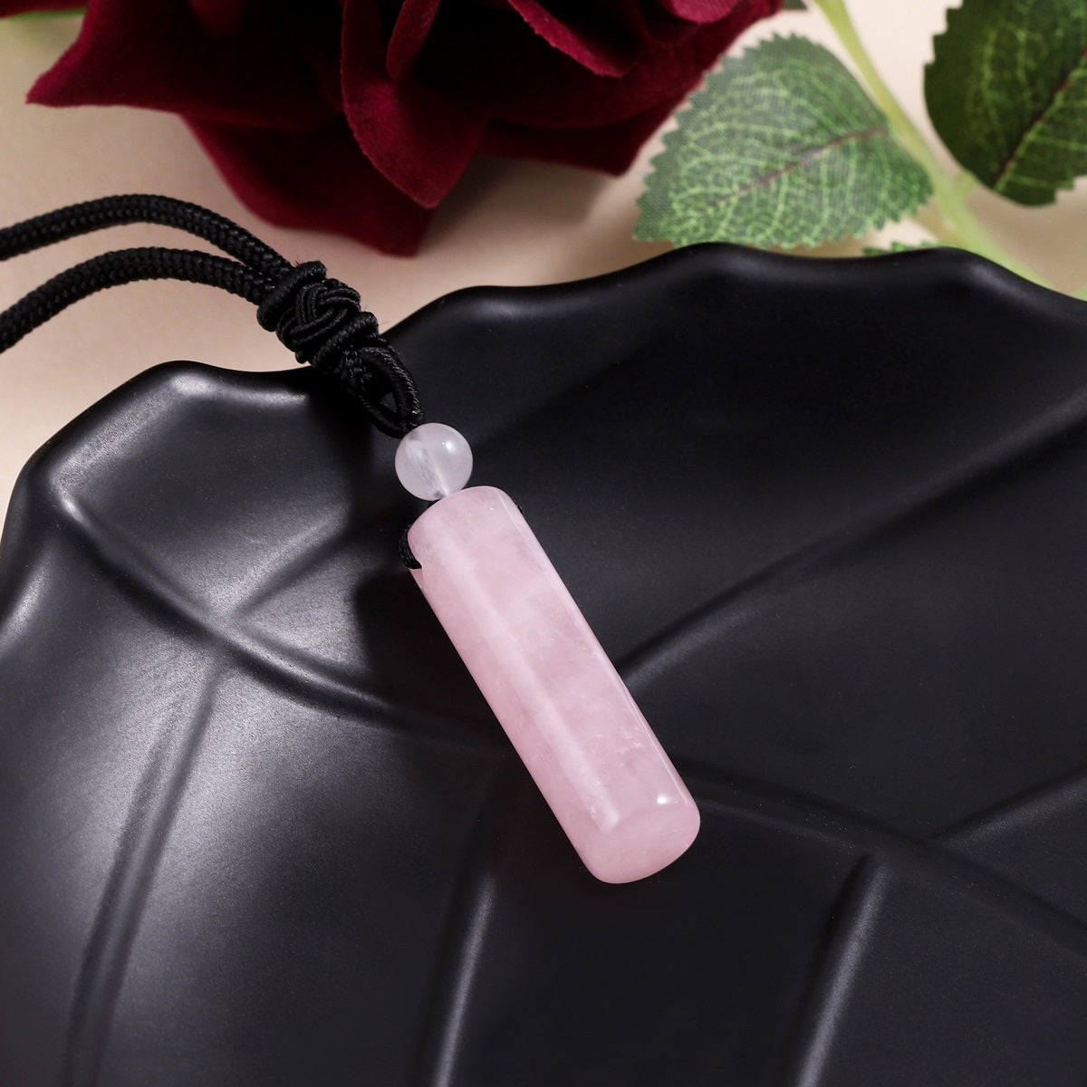Delicate wrapped design showcasing the Rose Quartz gemstone pendant