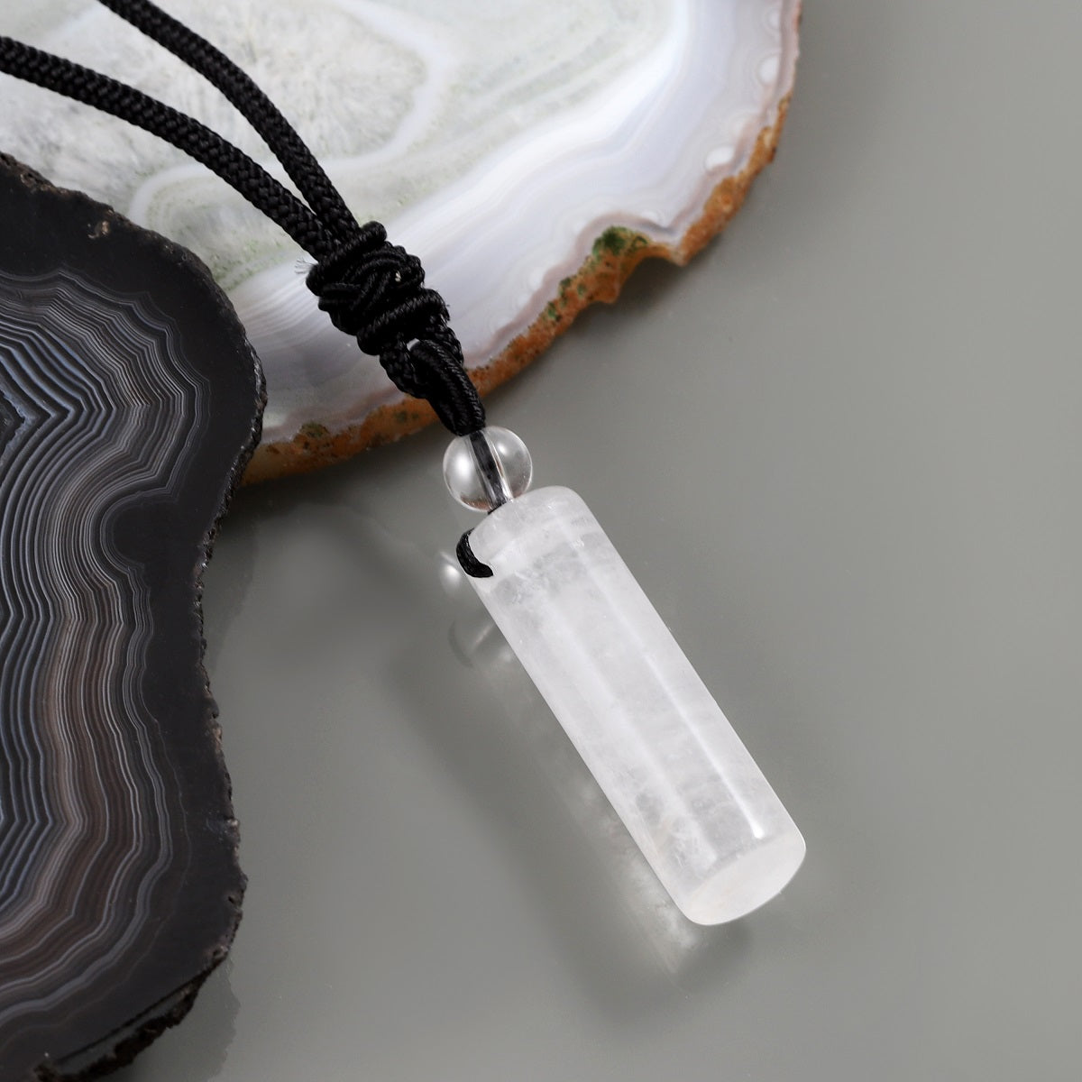 Delicate wrapped design showcasing the White Quartz gemstone pendant.