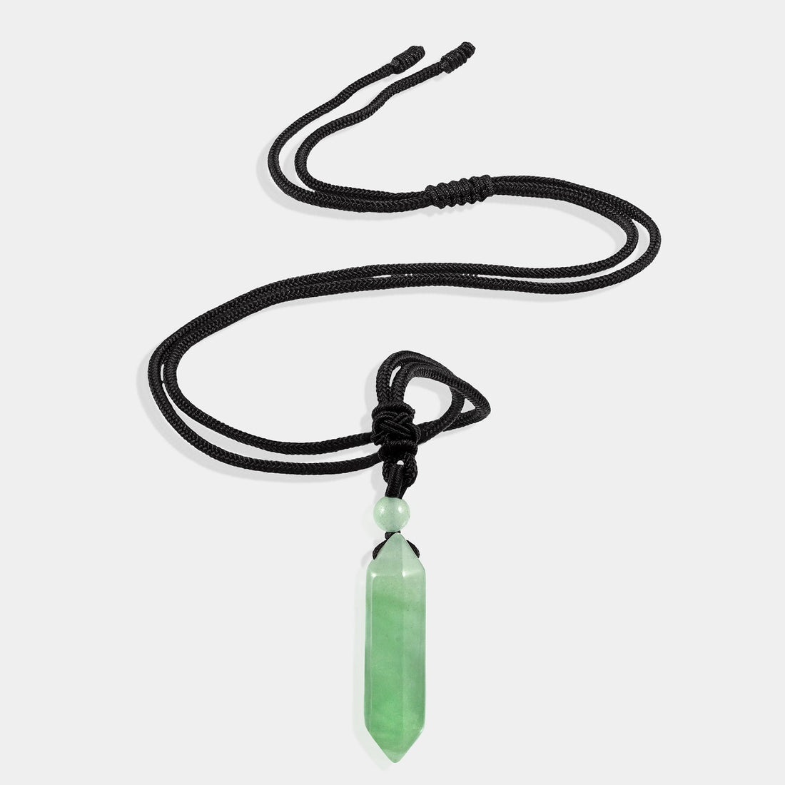 A stunning pendant necklace featuring a natural green aventurine gemstone in a hexagon-cut, wrapped in an intricate design.