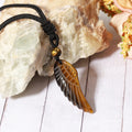Pendant wrapped necklace featuring a Tiger's Eye gemstone.