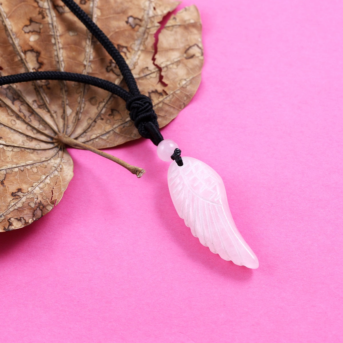 Pendant wrapped necklace featuring a rose quartz gemstone.