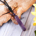 Delicate rope-wrapped design showcasing the Amethyst gemstone pendant.