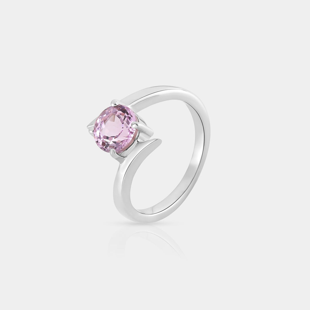 Close-up view capturing the 7mm round Kunzite, showcasing its delicate pink hue and intricate prong setting