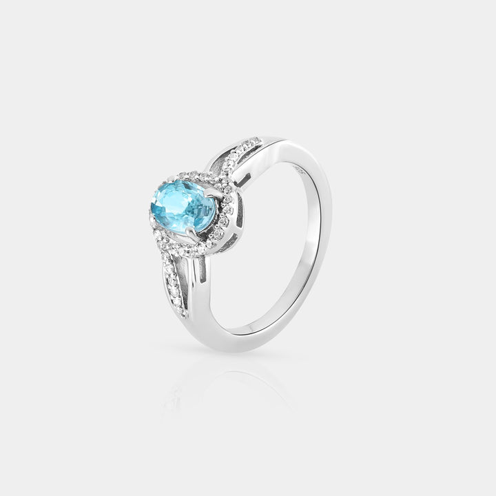 A captivating presentation of the Halo Ring, demonstrating the harmonious blend of the Blue Zircon centerpiece and the surrounding White Zircon accents