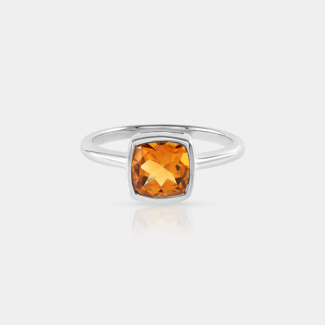 Side profile image emphasizing the meticulous bezel setting of the 7 mm Cushion-cut Citrine gemstone, showcasing its depth and brilliance