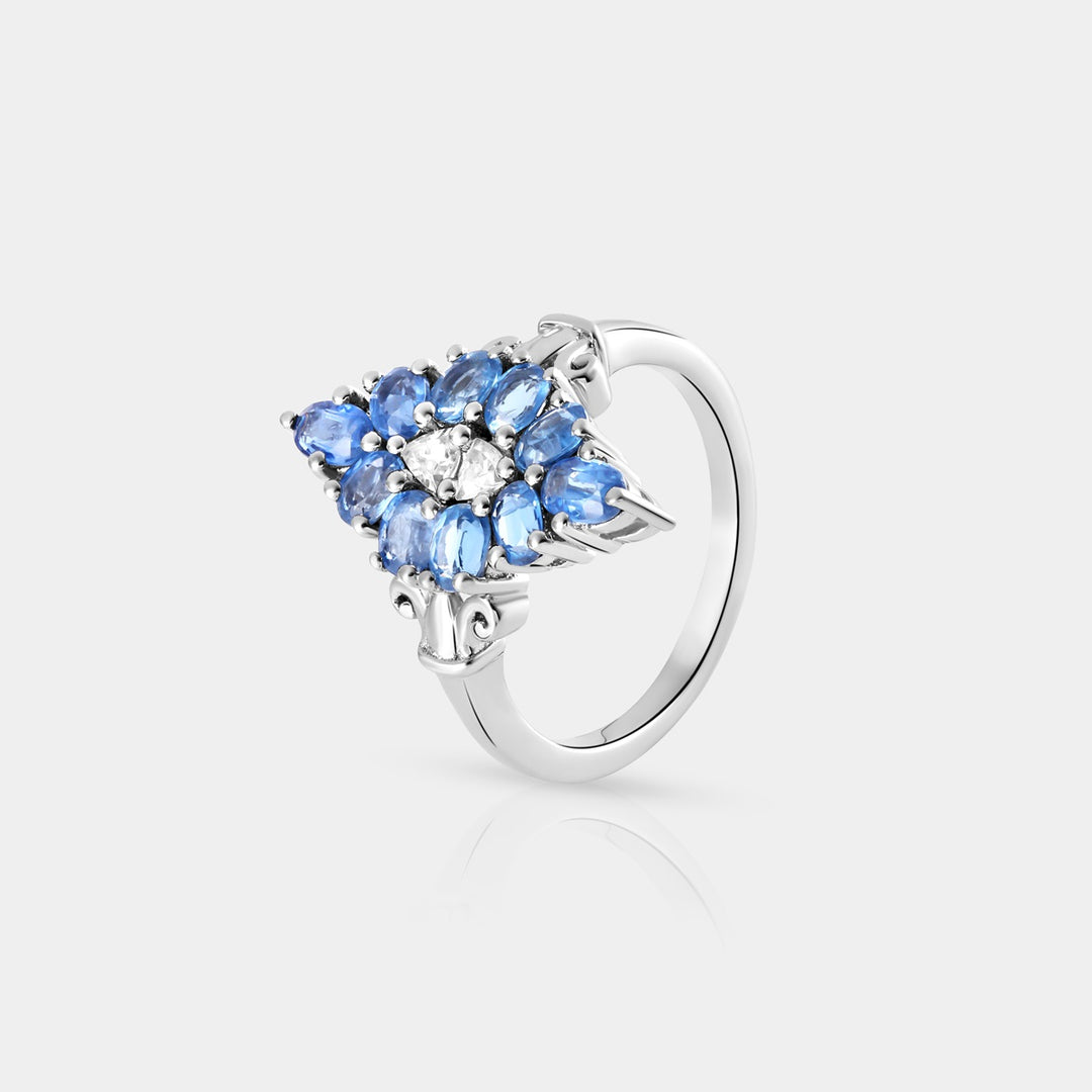 Side profile image highlighting the meticulous arrangement of 1.90 Carat Kyanite ovals and 0.30 Carat Trillion-cut White Topaz stones in a prong setting on the 925 Sterling Silver band