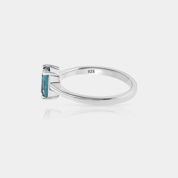 Inspiration shot featuring the Teal Kyanite Solitaire Ring, elegantly styled for evening wear, showcasing its versatility and timeless allure.