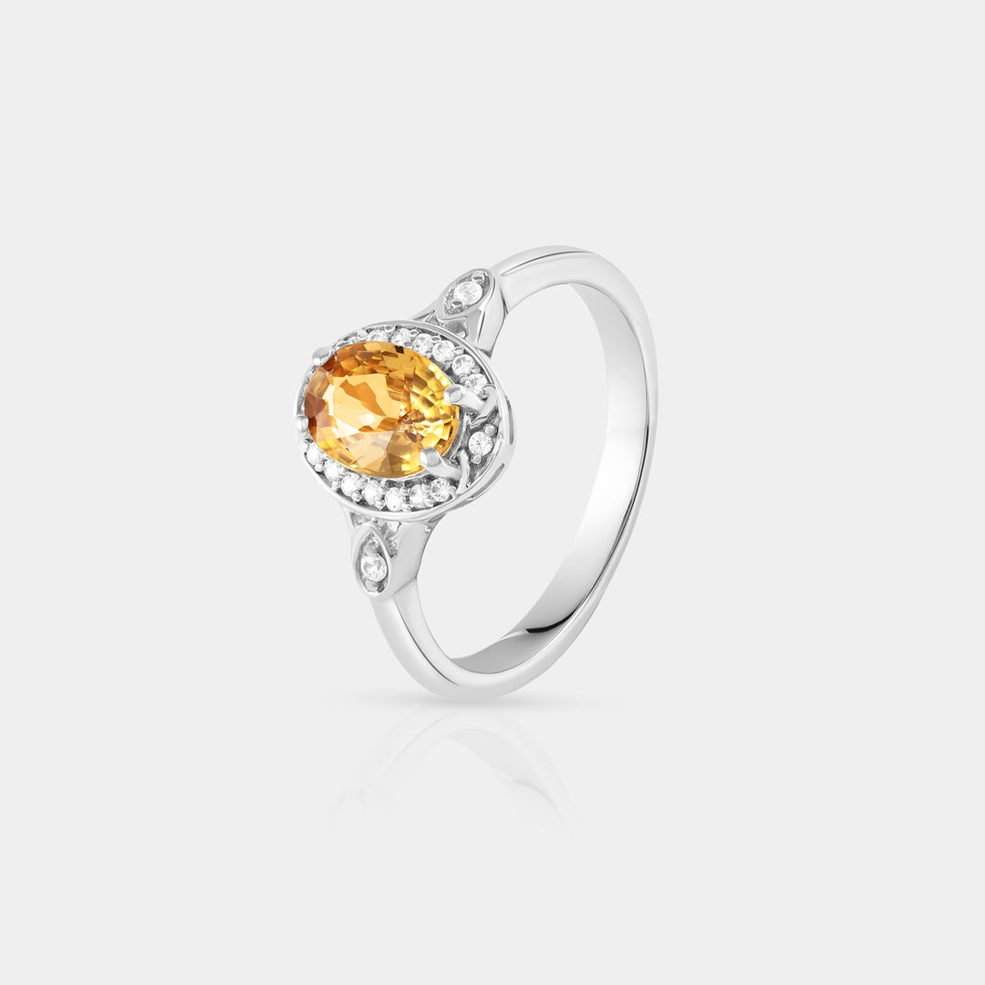 the vibrant 5.5x7.5mm oval Mandarin Orange Zircon, highlighting its rich color and intricate facets