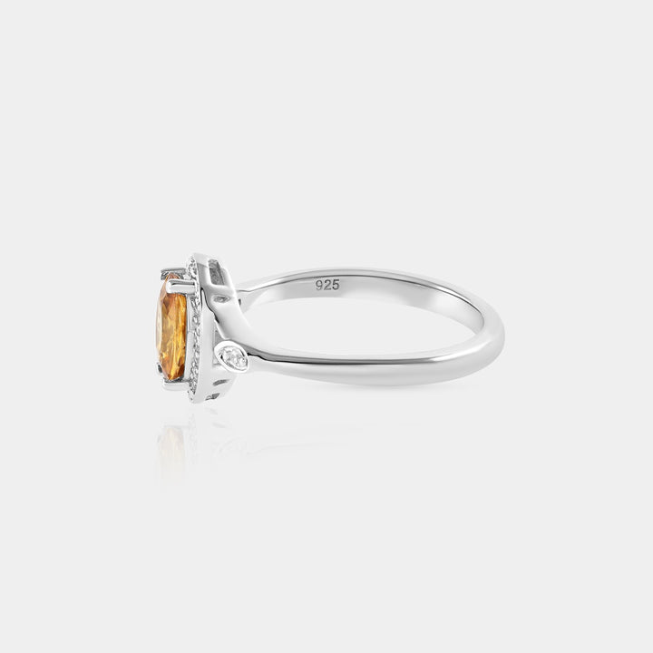 A captivating presentation of the Solitaire with Accents Ring, displaying the harmonious blend of Mandarin Orange and White Zircon, a perfect statement piece