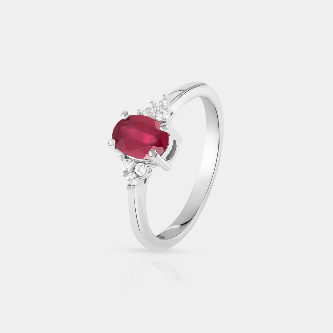 Side angle view capturing the intricate details of the Solitaire with Accent Ring. The six 1.5mm Zircon accents gracefully encircle the vibrant Ruby, adding a touch of sparkle