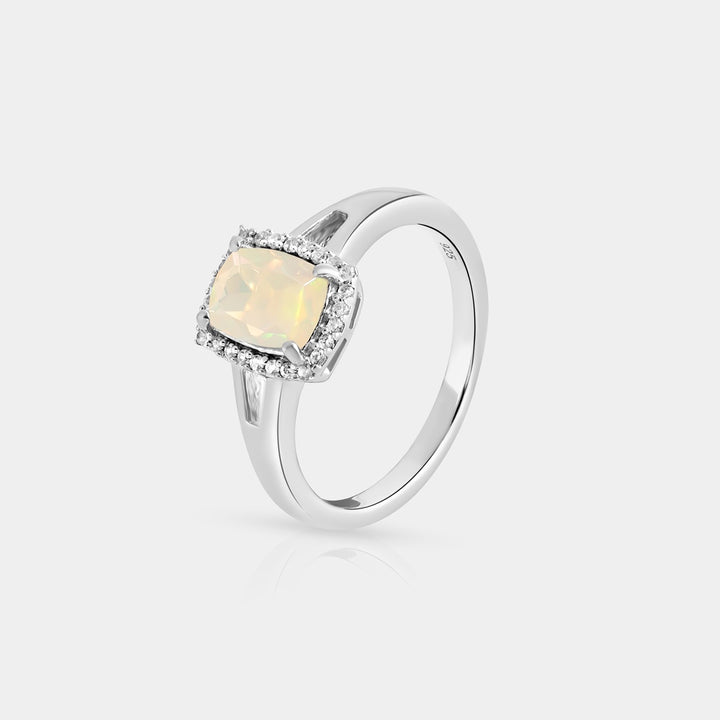 Side angle view capturing the intricate details of the Halo Ring. The halo of 26 1mm round Zircon accents adds a radiant brilliance to the opulence of the central opal.